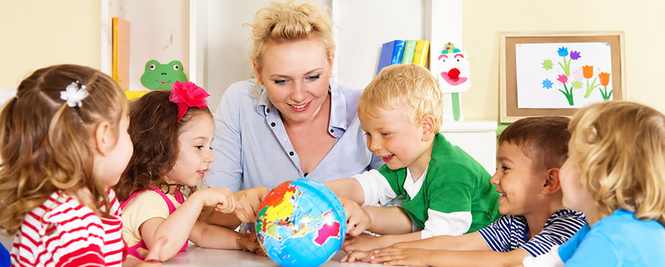 Children learning with their daycare teacher